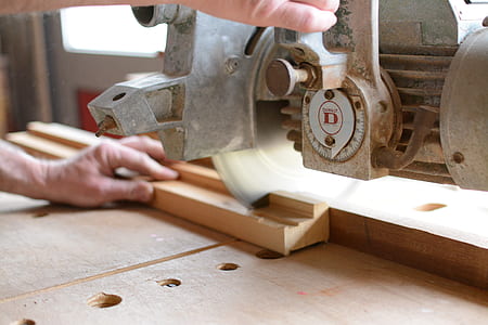 person holding gray power tool thumbnail