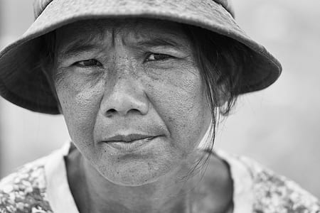 grayscale photo of woman wearing bucket hat thumbnail