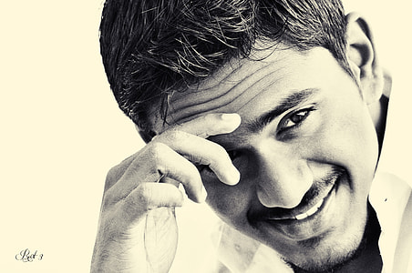 gray scale photo of man wearing collared top thumbnail