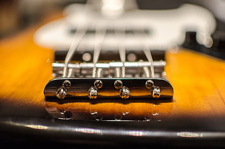 sunburst 4-string bass guitar close-up photography thumbnail