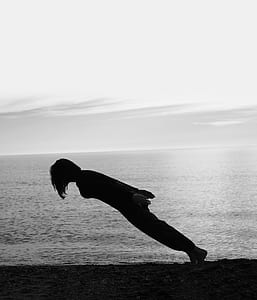 silhouette of person on seashore thumbnail