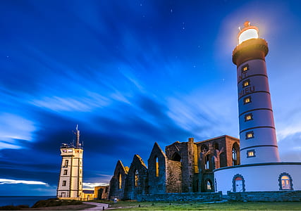 lighthouse near body of water thumbnail