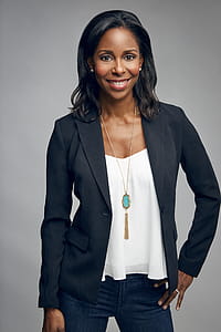 Woman Posing for Photo While Smiling thumbnail
