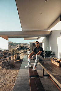 man sitting on table thumbnail