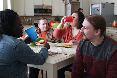 five people sitting near white table thumbnail