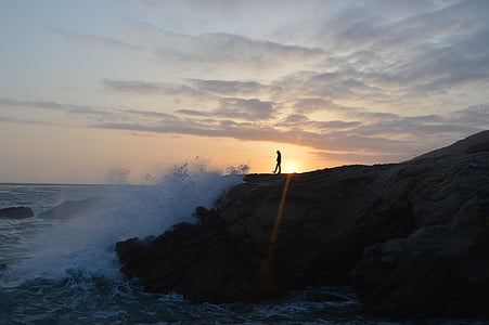 silhouette of person near cliff thumbnail