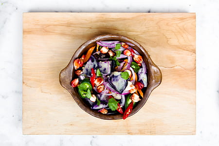 vegetable salad in brown wooden bowl thumbnail