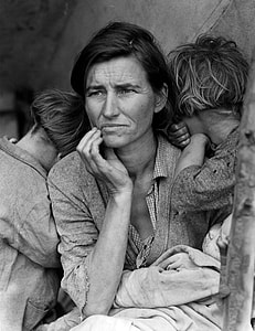 grayscale photo of a woman with her children thumbnail