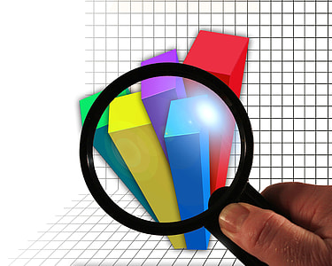 person holding black-framed magnifying glass thumbnail
