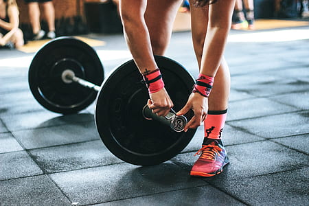 Person Holding Black Barbell thumbnail