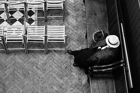 aerial view photography of person sitting on armchair grayscale photo thumbnail
