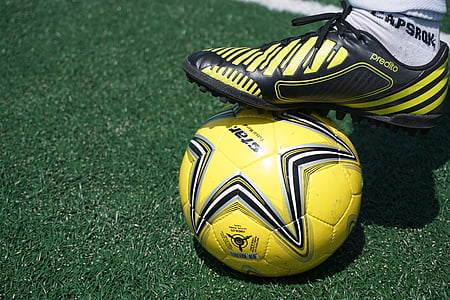 person wearing cleats stepping on soccer ball thumbnail