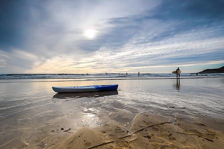 white kayak by the seashore thumbnail
