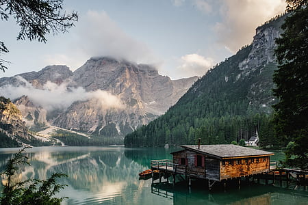 body of water and mountains painting thumbnail