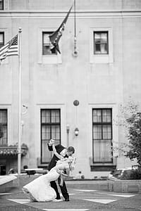 Bride and Groom Kissing Near Us Flag thumbnail