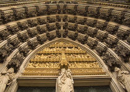 beige stone statues and arch doorway thumbnail