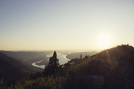 peak near body of water during golden hour thumbnail