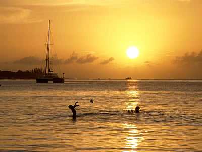 two people on beach in sunset photo thumbnail