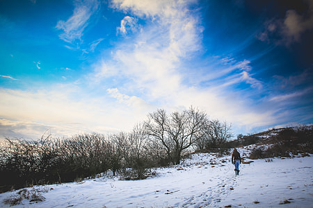 Girl Hiking on Snowy Hill thumbnail