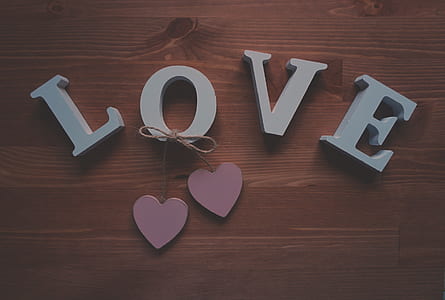 Love signage on brown surface thumbnail