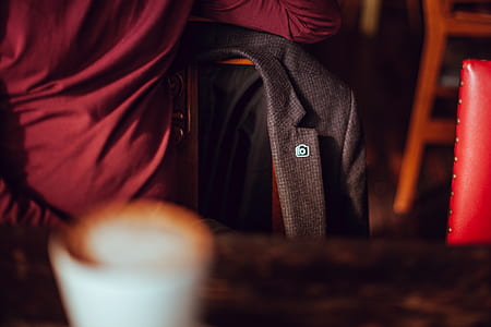 shallow focus photography of black coat thumbnail