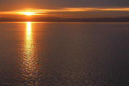 aerial view of body of water during golden hour thumbnail