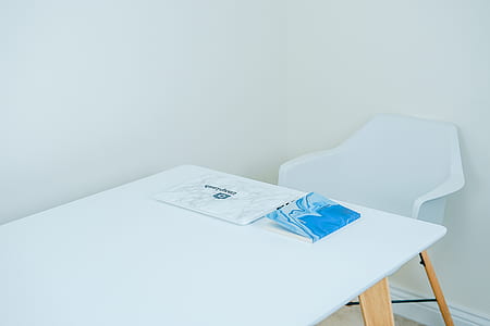 white and brown wooden table beside chair thumbnail