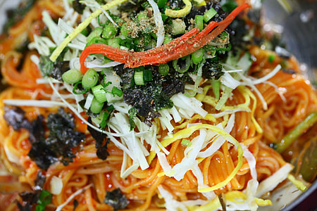 close-up photo of pasta with greens on top thumbnail