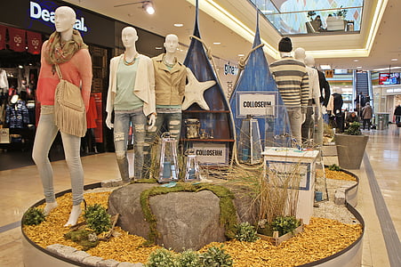 mannequins wearing clothes in the middle of mall thumbnail
