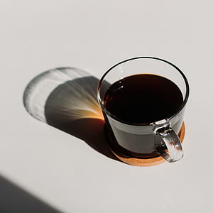 almost full clear mug on white surface thumbnail