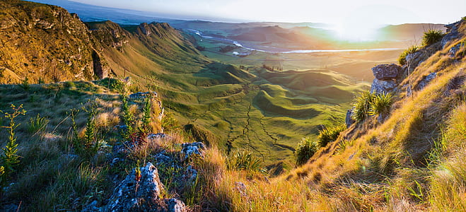 green grass covered mountain during daytime thumbnail