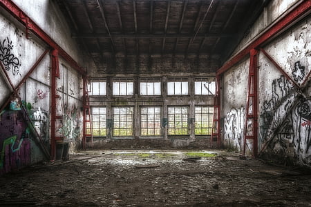 gray and red abandoned building with grafitti arts thumbnail
