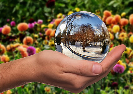 person holding glass ball thumbnail
