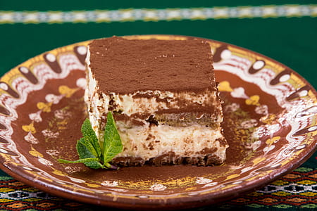piece of cake on round brown plate thumbnail