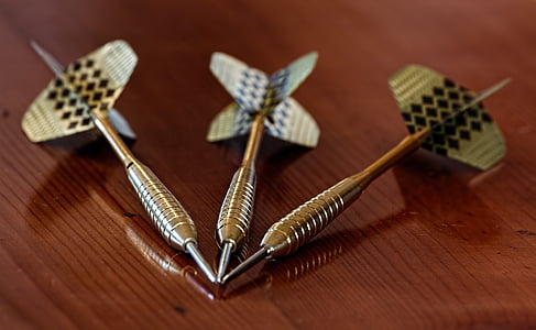 three silver-colored dart pins thumbnail
