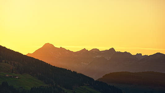 silhouette of mountain during golden hour thumbnail