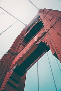 low-angle photography of red metal bridge thumbnail