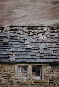 gray and brown brick house thumbnail