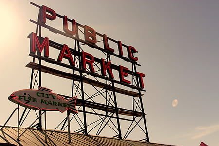 worm's-eye view photography of red metal public market signage thumbnail