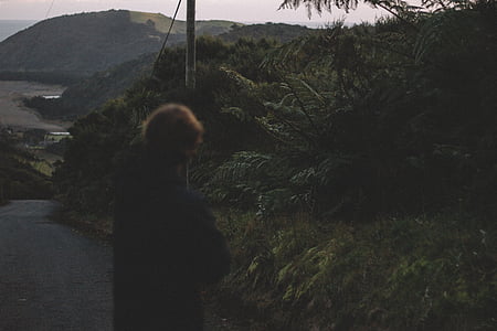 person standing near plants thumbnail