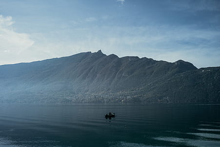 body of water and mountain ahead thumbnail