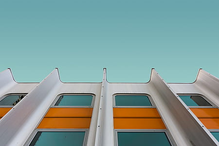 gray and orange high-rise building during daytime thumbnail