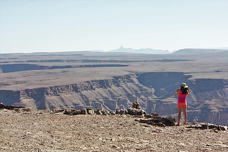 woman standing at edge of cliff thumbnail