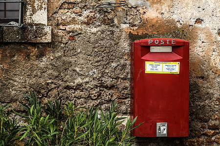 Red Mail Box Beside Green Grass thumbnail