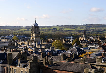 white cathedral surrounded by houses during daytime thumbnail