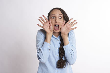 woman wearing blue long-sleeved button-up shirt thumbnail