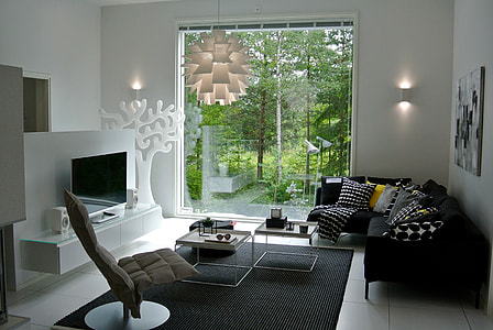 black fabric sectional sofa beside the clear glass window thumbnail