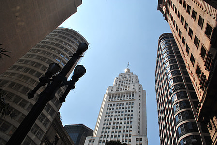 low angle photography of white concrete high rise building thumbnail