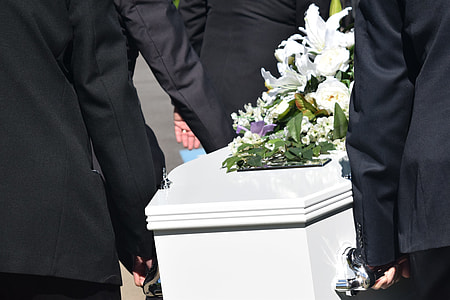 people carrying white coffin thumbnail