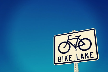 Bike Lane street signboard under blue sky thumbnail